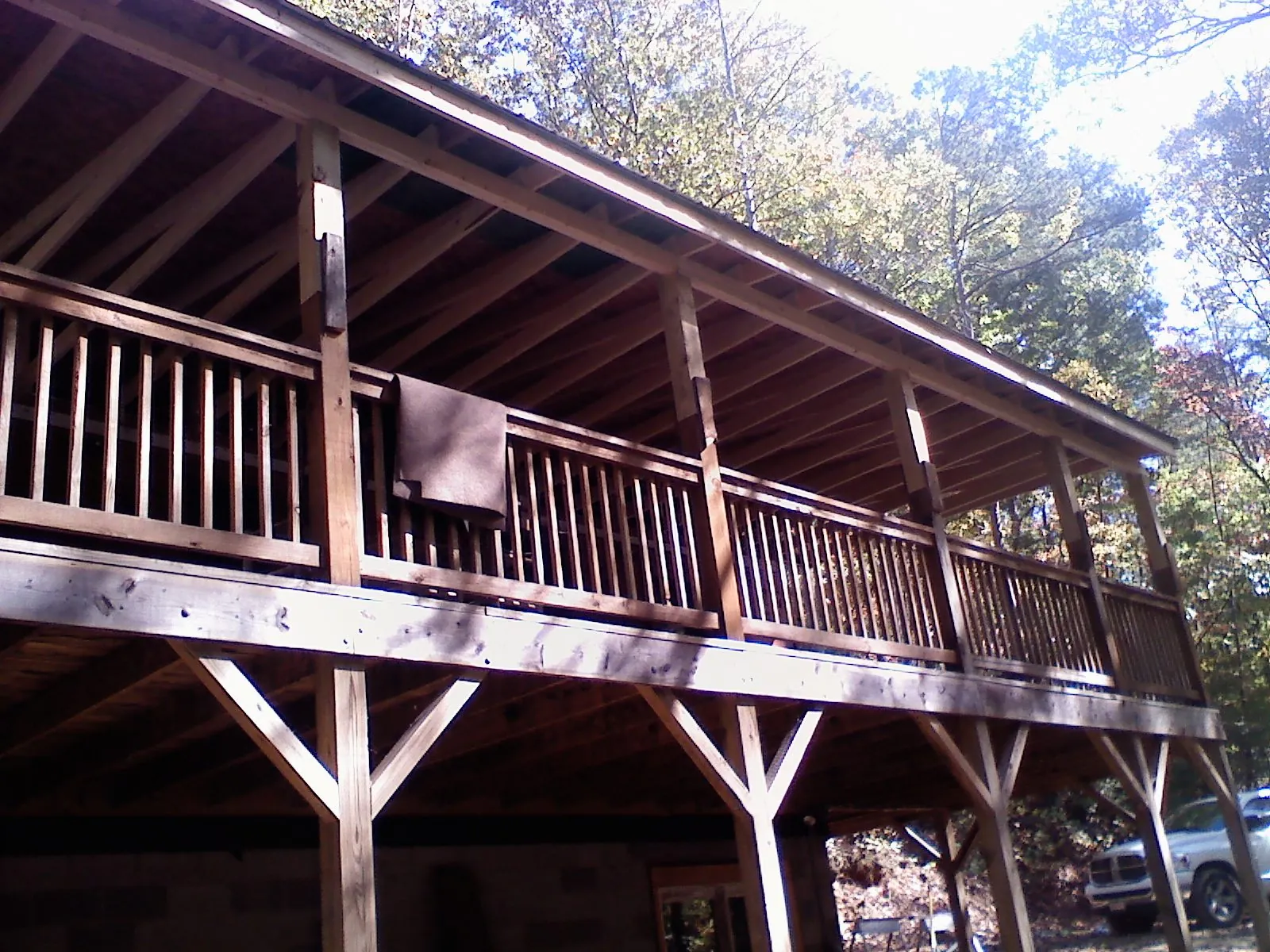Timber framing under a new elevated porch and deck — Roof Leak Repair in Newton by Roofing Brothers